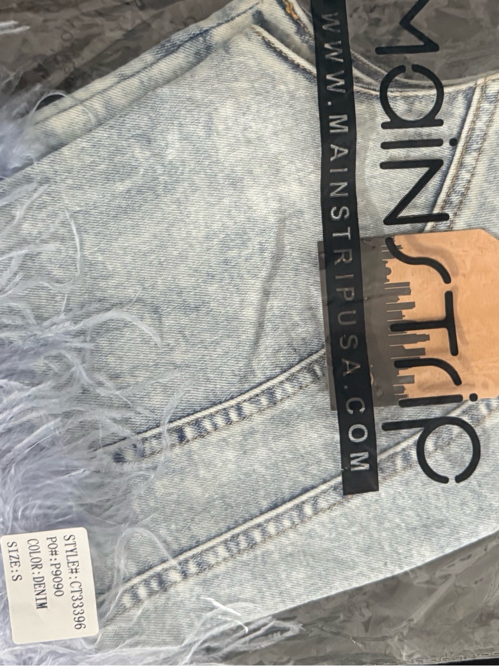 Main Strip Light Wash Denim Jeans with Feather Trim $25 each